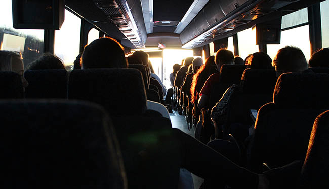 people enjoying a field trip in a charter bus