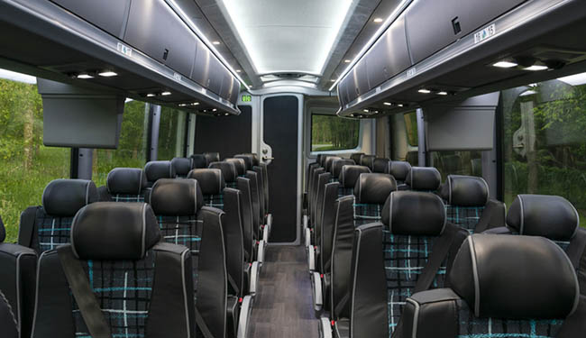Charter bus interior with ample space and comfortable seats